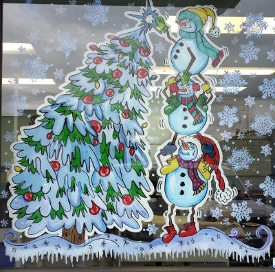 Snowmen decorating tree