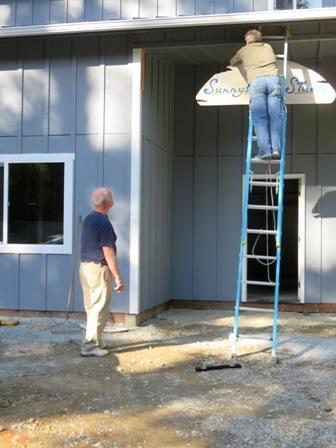 Sign at Sunnyshore Studio going up 