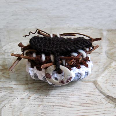 Organic Shaped Crocheted Basket with Sticks and Stone Closure Organic Shaped Crocheted Basket with Sticks and Stone Closure