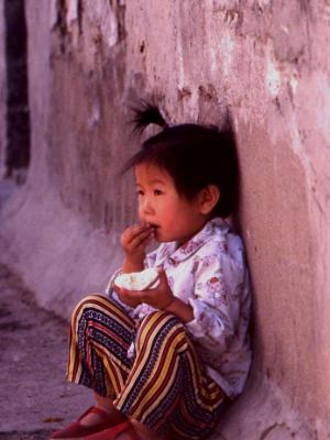 Chinese girl eating muffin, Pejing