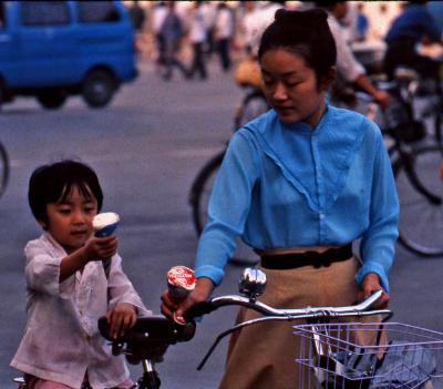 Chinese mom serving Ice cream on bikes