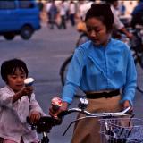 Chinese mom serving Ice cream on bikes