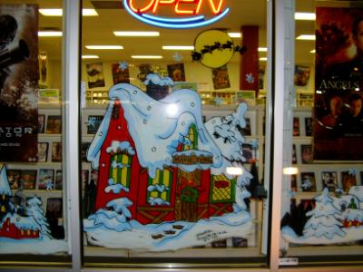 Winter house, Santa & deer flying over roof top.