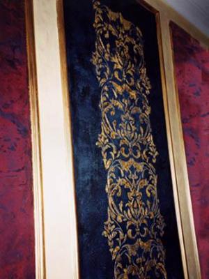 Raised gold leaf stencil on black stone finish Raised gold leaf stencil on black stone finish