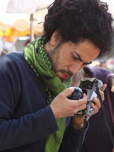 Man Examining  a Camera