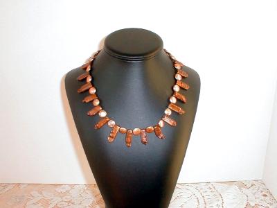 Golden freshwater biwa and coin pearls Golden freshwater biwa and coin pearls