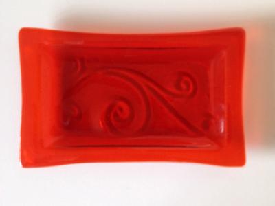 Orange tray with carved swirl
