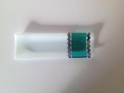 White plate with turquoise inset and dichroic twists