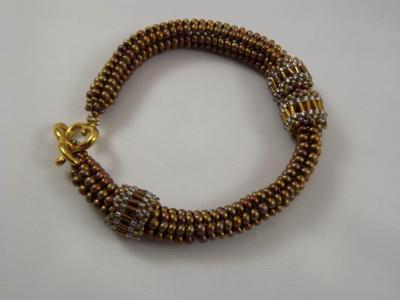 B-11 bronze ndebele bracelet with moveable rings B-11 bronze ndebele bracelet with moveable rings