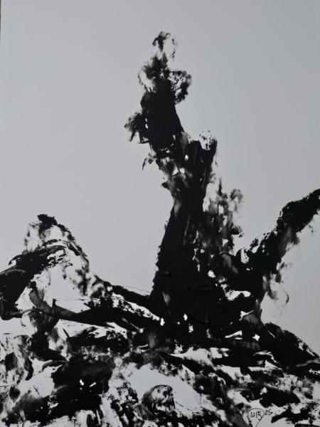 After the color has drained away, a lightning stuck tree stands against a stark background. 
