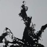 After the color has drained away, a lightning stuck tree stands against a stark background. 