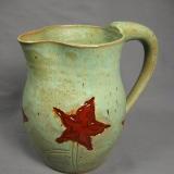 110621.F Pitcher with Flower Design