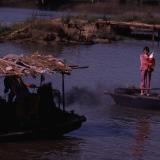 Chinese woman standing on boat