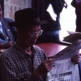 Chinese man reading, L.A.,Chinatown