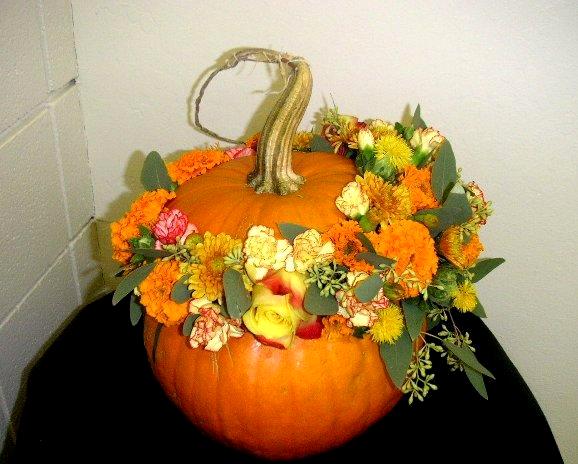 Pumpkin decoration with floral arrangement for Halloween - California ...