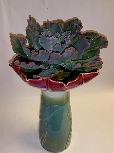 Flower shaped vase with succulent