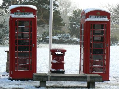 Red Phone Boxes in the Snow