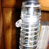 Bottle necks are embellished with metal wire,some with glass beads.