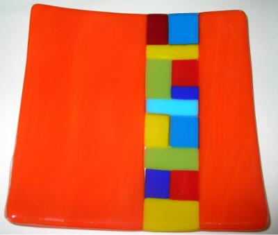 Orange plate with colored squares inset Orange plate with colored squares inset