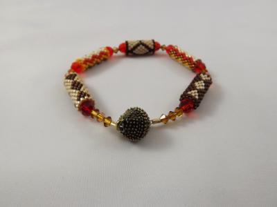 B-92 brown, orange, ecru, & amber beaded tube bracelet B-92 brown, orange, ecru, & amber beaded tube bracelet