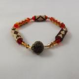 B-92 brown, orange, ecru, & amber beaded tube bracelet