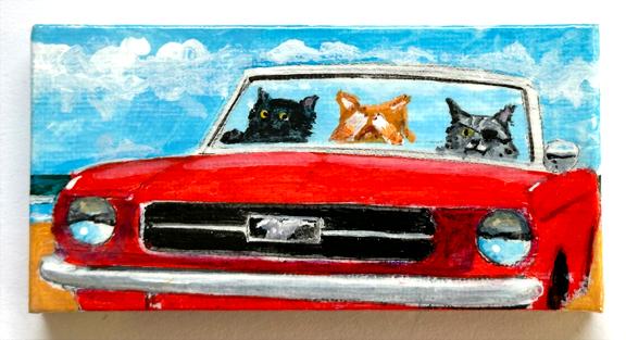 THREE CATS IN A RED MUSTANG