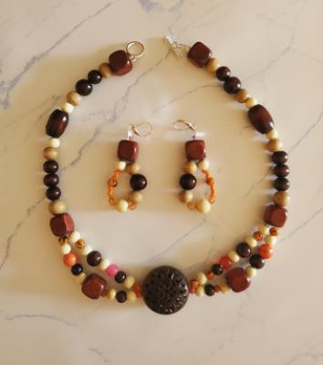 Shades of Wood and Orange accent beads with Dark wood Ornament 