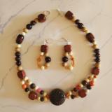 Shades of Wood and Orange accent beads with Dark wood Ornament 