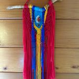 Red/yellow/turquoise Macrame with a hand made wire wrapped glass bead
