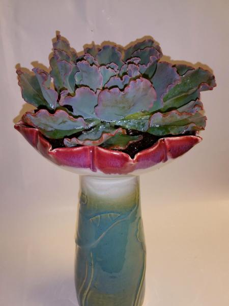 Flower shaped vase with succulent