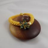 B-110 golden yellow crocheted rope bracelet w/flower