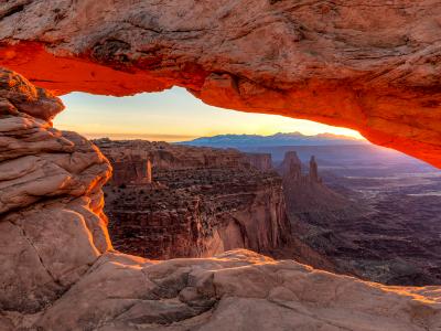 Orange sunrise glow on Mesa Arch Orange sunrise glow on Mesa Arch