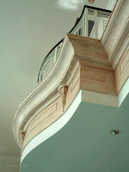 Antiqued crown moldings and sconces