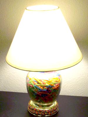 Reclaimed lamp filled with pieces of colorful straws. Reclaimed lamp filled with pieces of colorful straws.