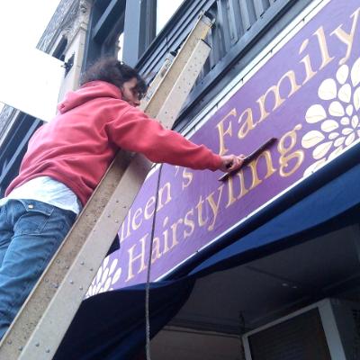 Handpainted exterior sign for Colleen's Family Hair Salon