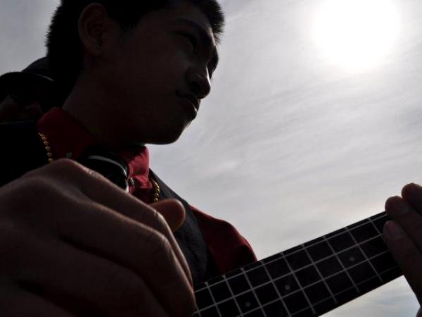 Joren playing the Ukulele