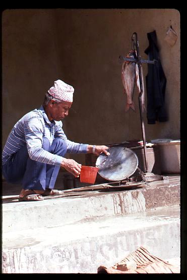 Nepalese man selling fish
