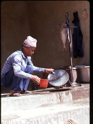 Nepalese man selling fish