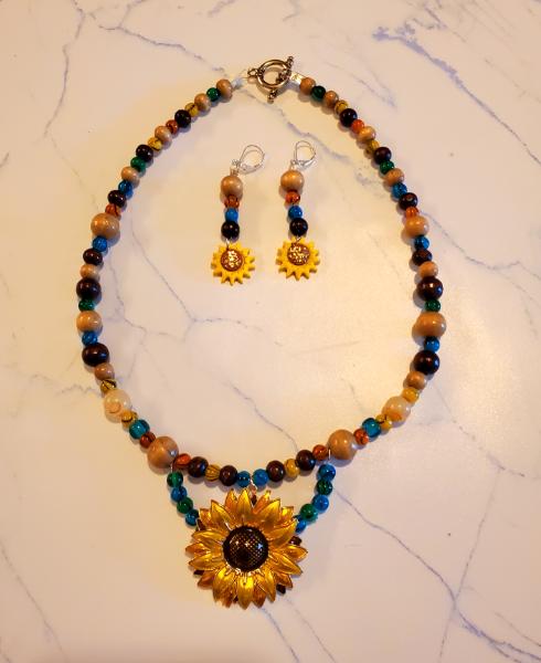 Earthy Multi-mix glass and wood with  Gold metal Sunflower pendant