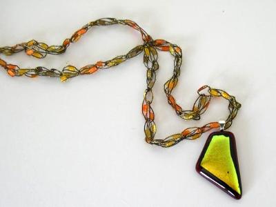 Gold dichroic glass on red Gold dichroic glass on red