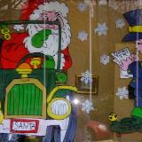 Santa in car getting seatbelt ticket from elf police.