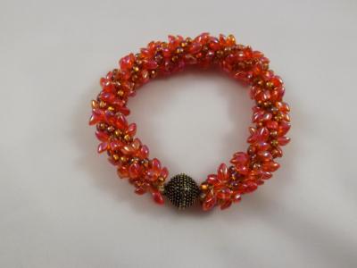 B-37 orange spikey bracelet