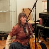 Alis Maun providing entertainment with morencora and vocals