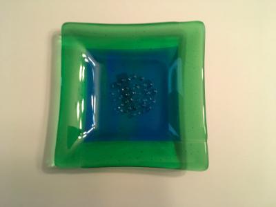 Green and blue garlic and oil plate Green and blue garlic and oil plate