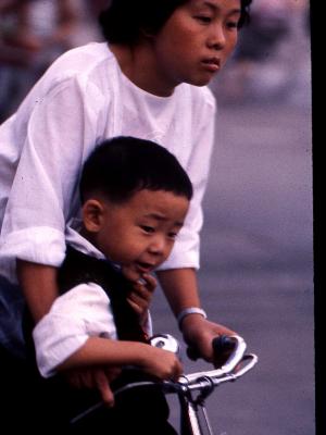 Chinese Mother and son on bike