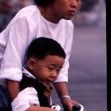 Chinese Mother and son on bike