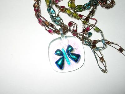 Dichroic "butterfly" on clear dichroic glass Dichroic "butterfly" on clear dichroic glass
