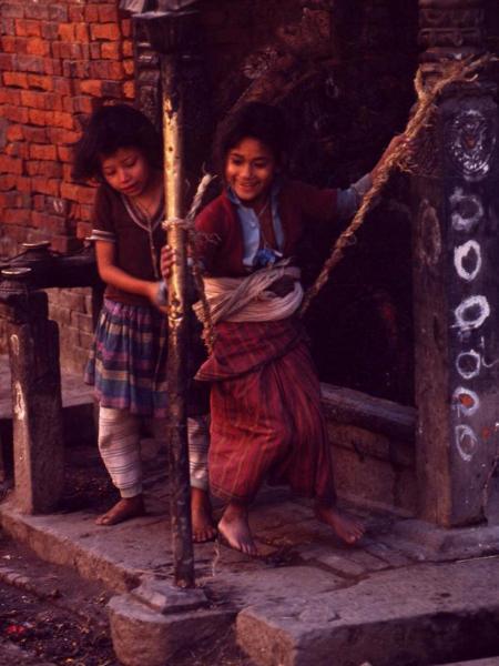Nepalese girls on a swing
