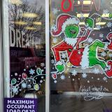 Grumpy Green guy Climbing Christmas lights