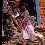 Nepalese girl crossing puddle